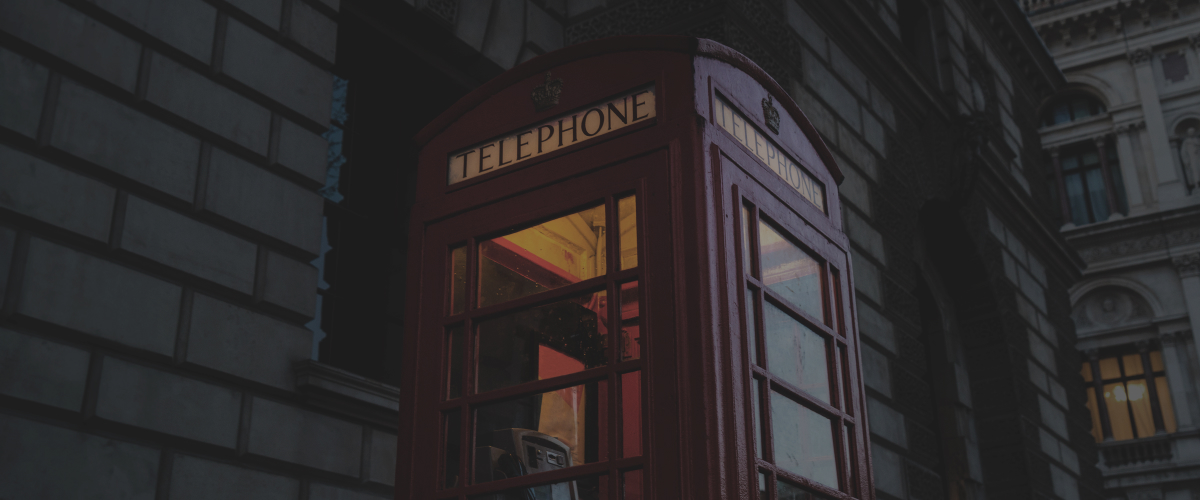 The red phone box and yellow light on a dark screen are not crisp and clear, showing a conventional display with relatively inaccurate color representation.